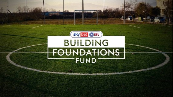Sky Bet Building Foundations Fund logo on a football pitch