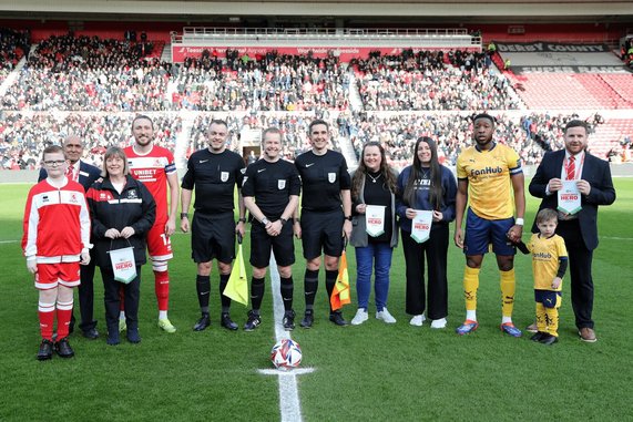 Club and Foundation Community Heroes are pictured collecting their award