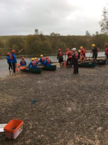 Group of young people about to go canoeing