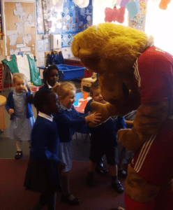 Roary gives a young boy a high five
