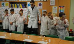 Stewart Downing takes part in an experiment with some pupils