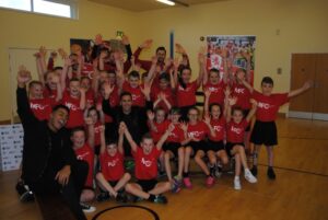 Stewart Downing and a P.E. class raise their hands in the air