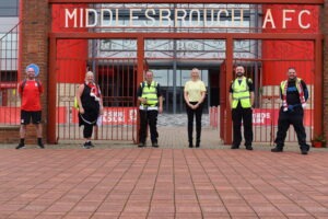 Head of MFC Foundation Heelna Bowman greets the five walkers who raised money for the Foundation by walking from Rockliffe to the Riverside