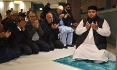 Imam Wajid Malik leads prayers in the Fenton Suite at the Riverside