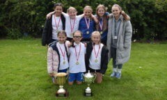 Girls Tournament and Group Winners in the 2024 Wilf Mannion Cup St Edward's Girls display their trophy.